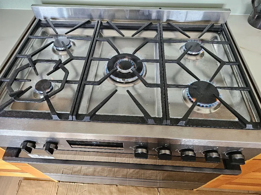 A new gas cooker with all burners lit