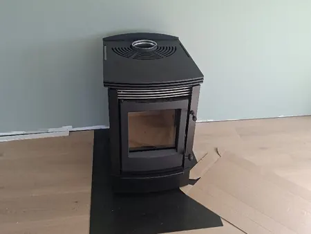 A new wood fire on its hearth in a renovated living room