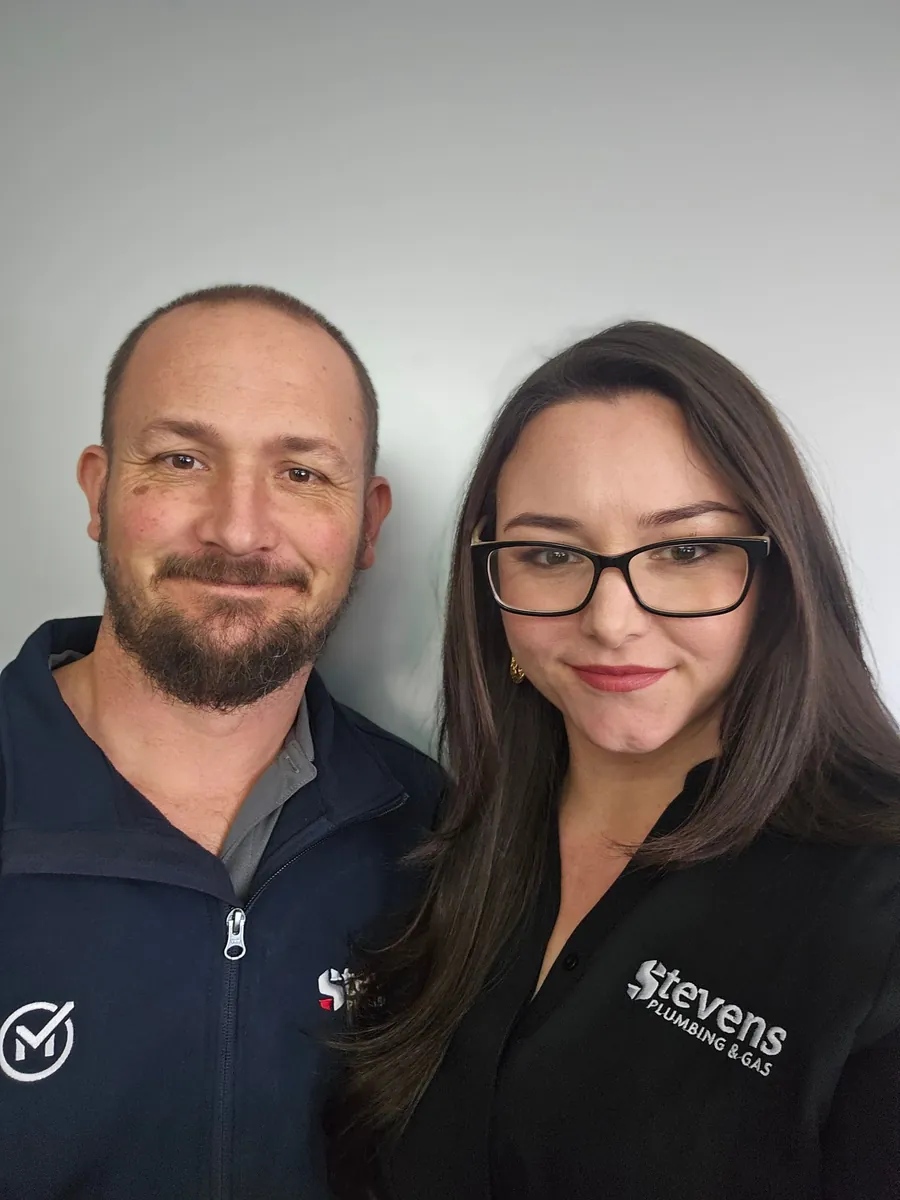 Josh and Kristy, the directors of Stevens Plumbing and Gas, in their Stevens tops