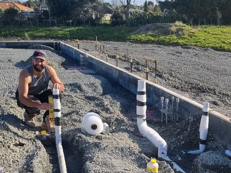 New drainage pipes laid in a trench on a building site