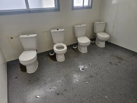 The old toilets in a Hurupaki School block, lifted ready for the strip-out