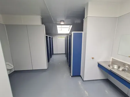 The finished row of new toilet cubicles and a basin at the Kai Iwi Lakes toilet block
